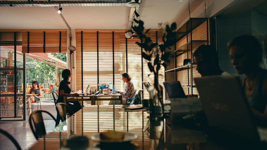 group of people sitting while using laptop computer