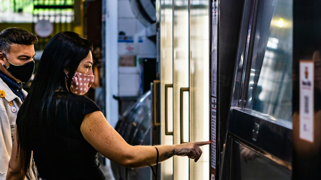 woman in black t-shirt standing beside glass window