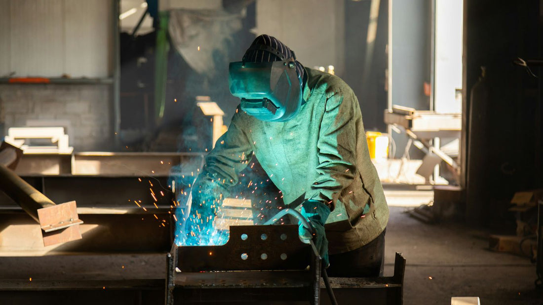 a welder working on a piece of metal