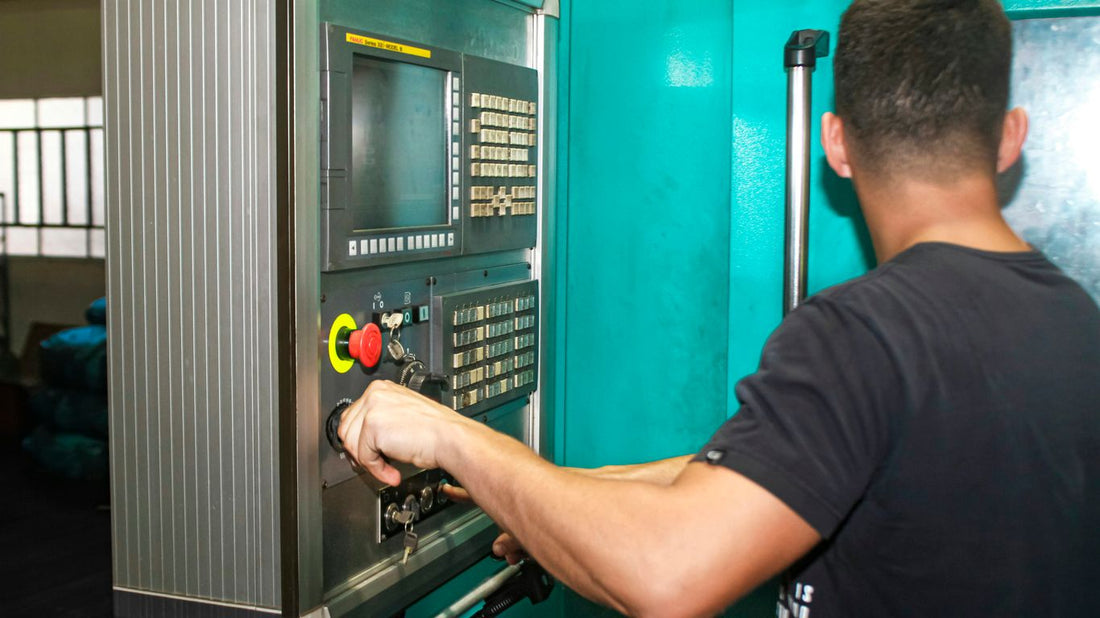 A man working on a machine in a factory