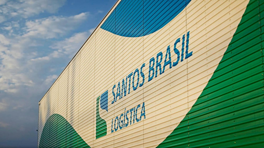 a green and white building with a blue sky in the background