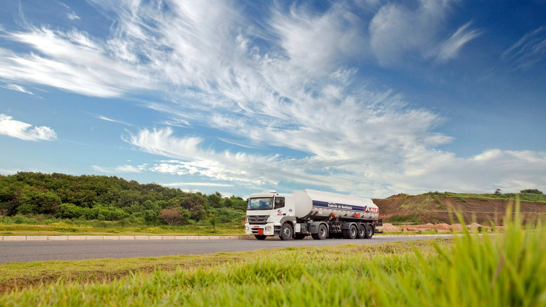 white and black storage truck on gray asphalt road